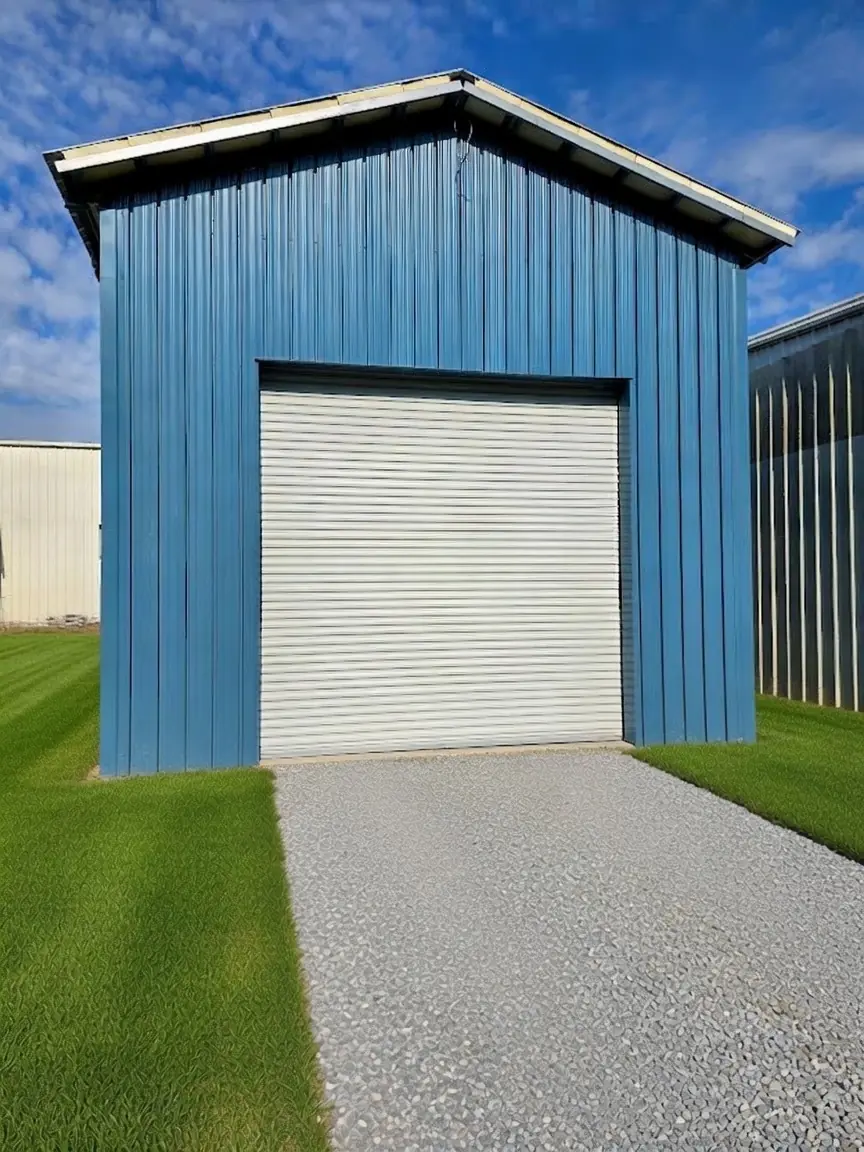 Blue storage building with RW-9 36 wall panels and a roll-up door on Falcon's Montevallo, AL property