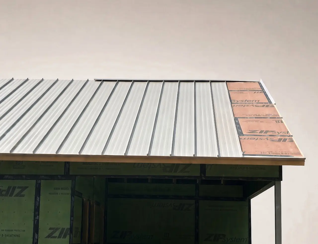 Standing seam roof panels being installed on a Falcon home project in Birmingham, AL